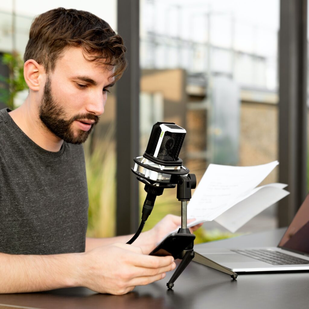 man reading from notes