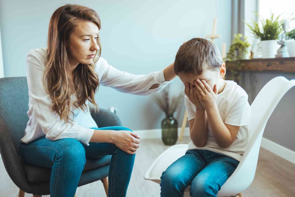 Young boy having therapy with a child psychologist