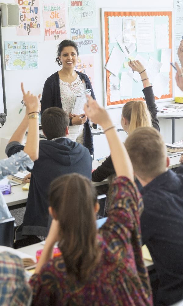 Teacher happy in the classroom where she feels supported